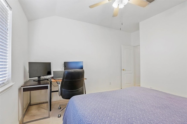 bedroom with vaulted ceiling, ceiling fan, and carpet flooring