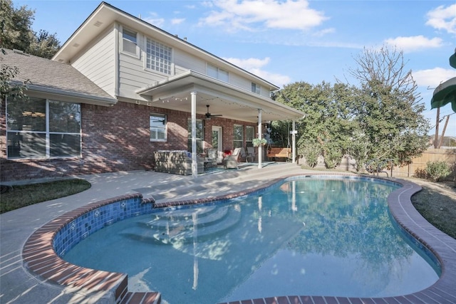 view of pool featuring a patio and ceiling fan