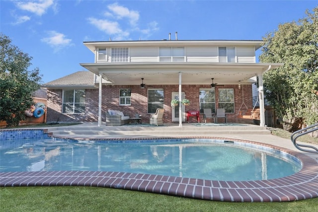 rear view of house featuring ceiling fan, outdoor lounge area, and a patio area