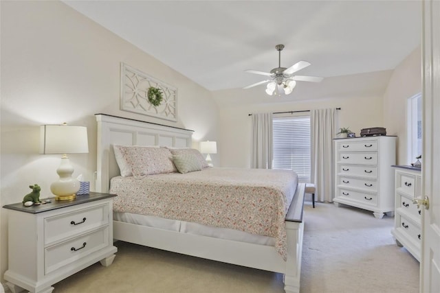 bedroom with light carpet and ceiling fan