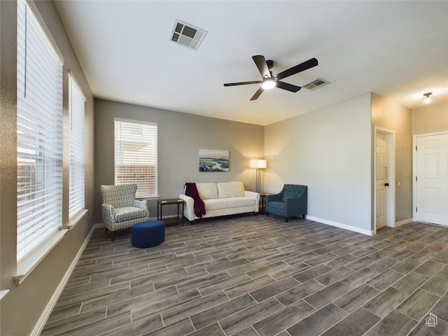 sitting room featuring ceiling fan