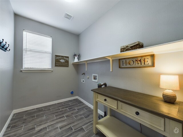 laundry area featuring hookup for a gas dryer, electric dryer hookup, hookup for a washing machine, baseboards, and dark wood-style flooring