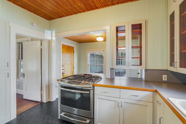 3014 Hemphill Park, Austin, TX 78705 - kitchen featuring stainless steel gas range oven, wood ceiling, glass insert cabinets, light countertops, and white cabinets