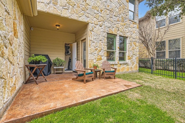 view of patio / terrace featuring fence