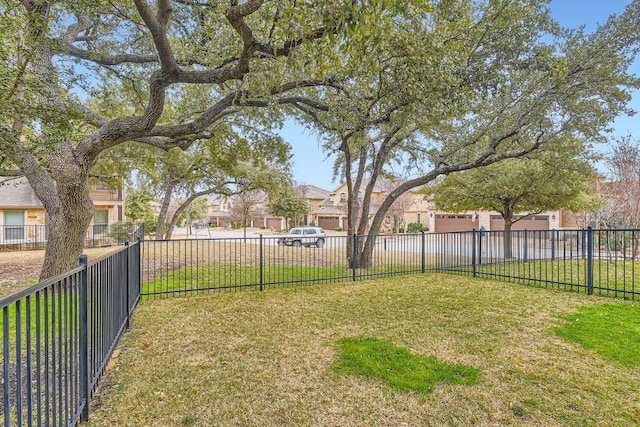 view of yard with a residential view and fence