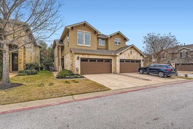 traditional home featuring a garage, stone siding, concrete driveway, stucco siding, and a front lawn