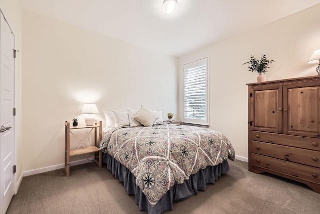 bedroom featuring light carpet and baseboards