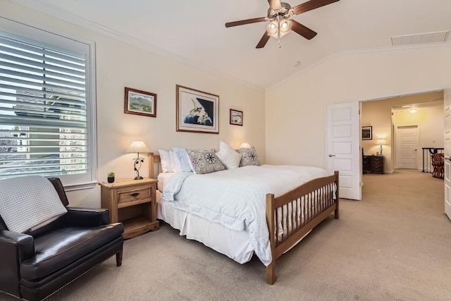 bedroom featuring ceiling fan, light colored carpet, ornamental molding, and vaulted ceiling