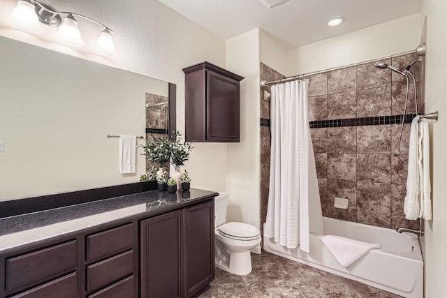 bathroom with toilet, shower / bath combo, and vanity