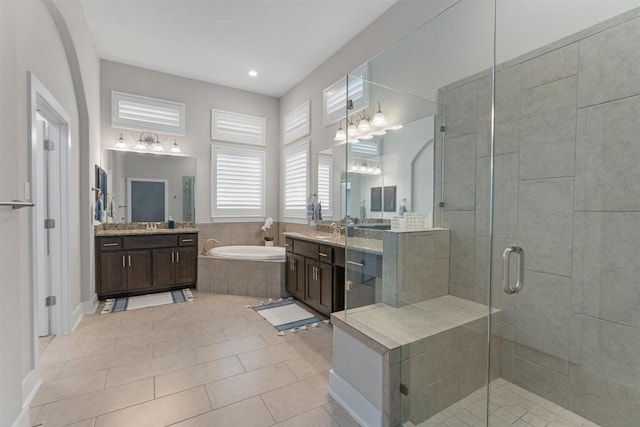 bathroom with vanity, tile patterned floors, and independent shower and bath