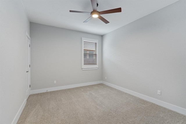 empty room with light carpet and ceiling fan