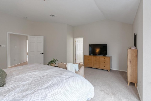 bedroom featuring light carpet, baseboards, visible vents, and lofted ceiling