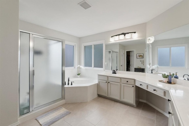 bathroom featuring a stall shower, visible vents, tile patterned flooring, vanity, and a bath