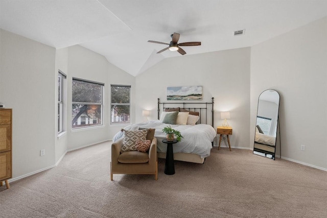 carpeted bedroom with lofted ceiling, a ceiling fan, visible vents, and baseboards