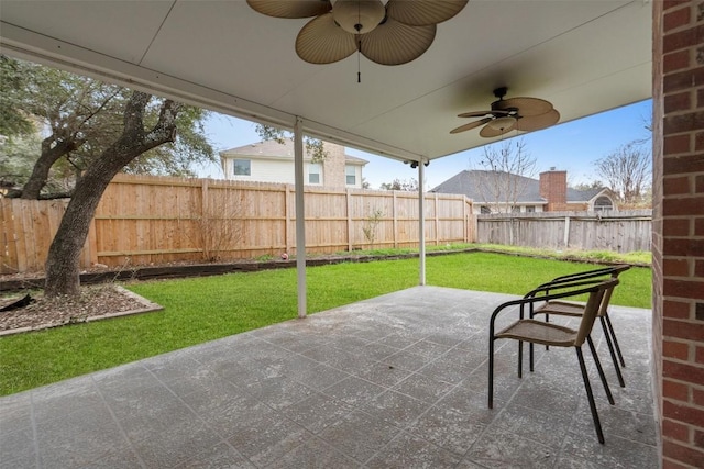 view of patio / terrace with a ceiling fan and a fenced backyard