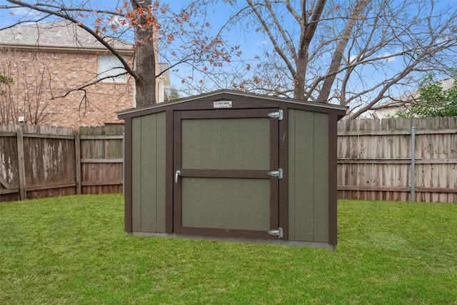 view of shed with a fenced backyard