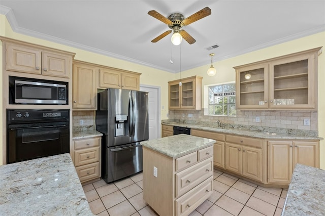 kitchen featuring ornamental molding, a kitchen island, decorative backsplash, and black appliances