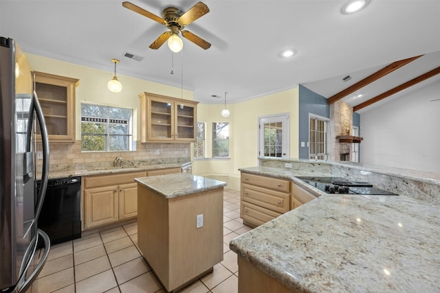 kitchen featuring a kitchen island, decorative light fixtures, light stone counters, black appliances, and light brown cabinets