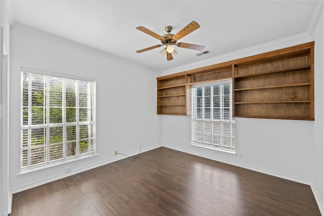 spare room with crown molding, dark hardwood / wood-style floors, and ceiling fan