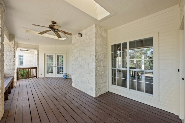 wooden deck featuring french doors and ceiling fan