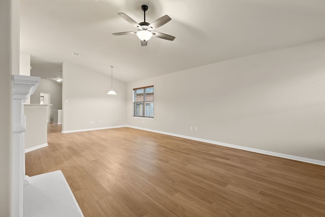 unfurnished living room featuring light hardwood / wood-style floors, lofted ceiling, and ceiling fan