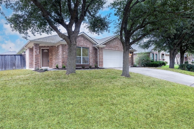 view of front of property featuring a garage and a front lawn