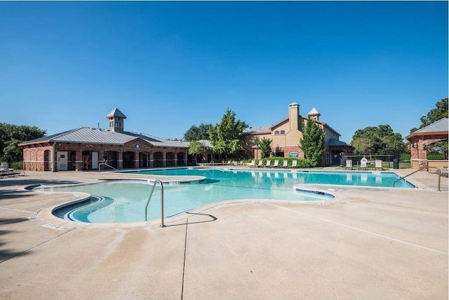 view of swimming pool featuring a patio