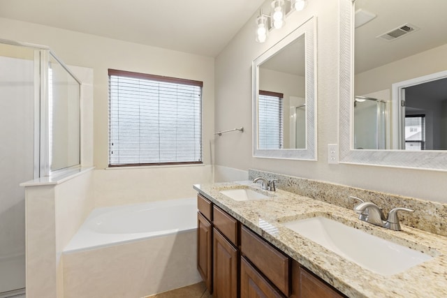 4323 Fairway Path, Round Rock, TX 78665 - bathroom featuring a shower stall, a bath, double vanity, and healthy amount of natural light