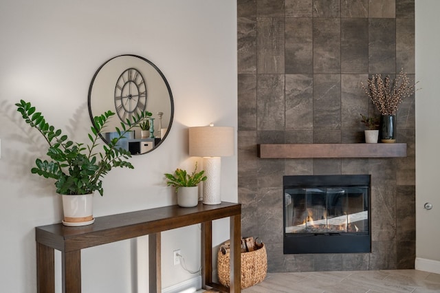 details with a tile fireplace