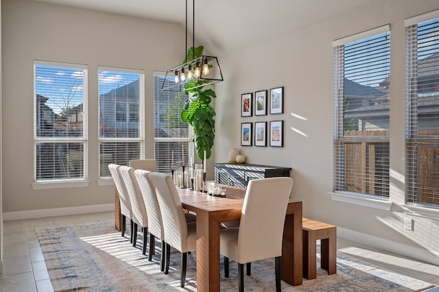 dining area with light tile patterned flooring