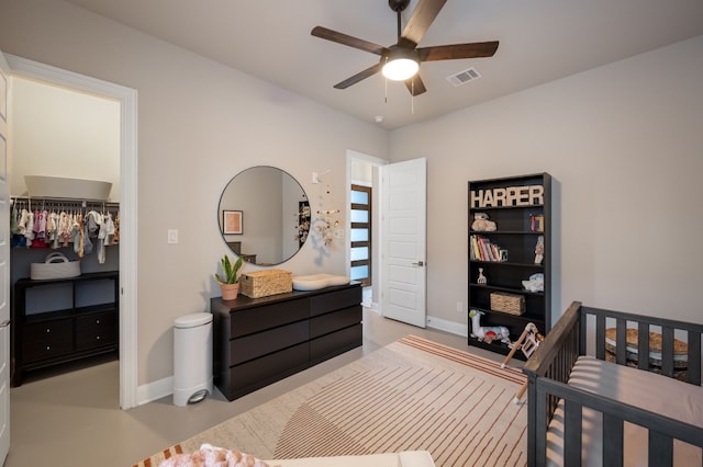 bedroom with ceiling fan and a closet