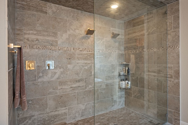 bathroom with a tile shower