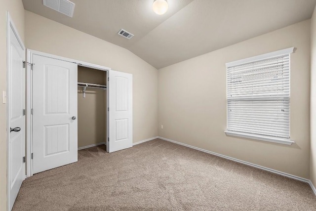 15210 Walcott Dr, Austin, TX 78725 - unfurnished bedroom featuring carpet, vaulted ceiling, and a closet