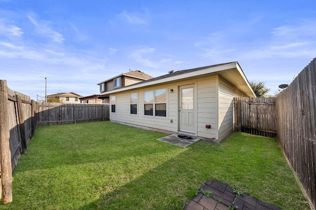15210 Walcott Dr, Austin, TX 78725 - rear view of house with a fenced backyard
