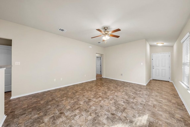 15210 Walcott Dr, Austin, TX 78725 - unfurnished room featuring ceiling fan and stone finish floors