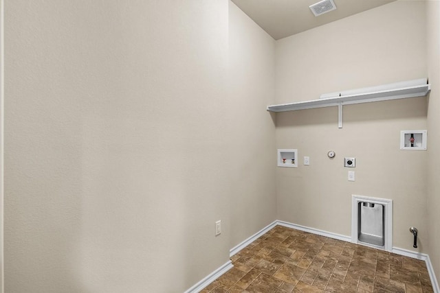 15210 Walcott Dr, Austin, TX 78725 - laundry room with gas dryer hookup, hookup for a washing machine, hookup for an electric dryer, and stone finish flooring