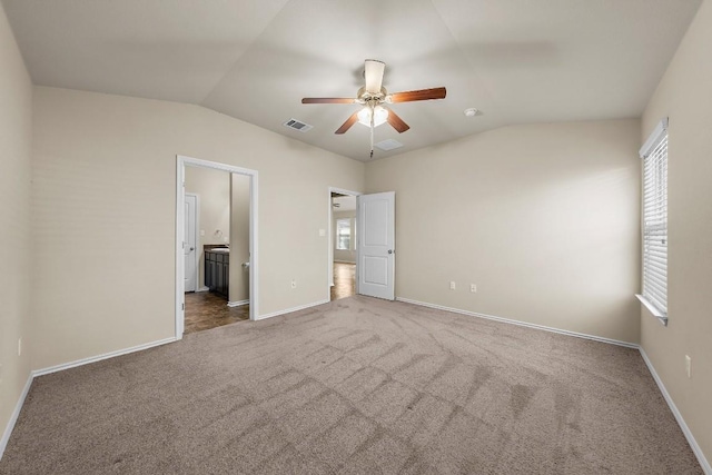 15210 Walcott Dr, Austin, TX 78725 - unfurnished bedroom with lofted ceiling, carpet flooring, ensuite bathroom, and a ceiling fan