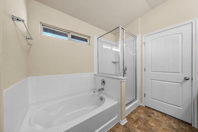 15210 Walcott Dr, Austin, TX 78725 - bathroom featuring a garden tub, a shower stall, and stone finish floors