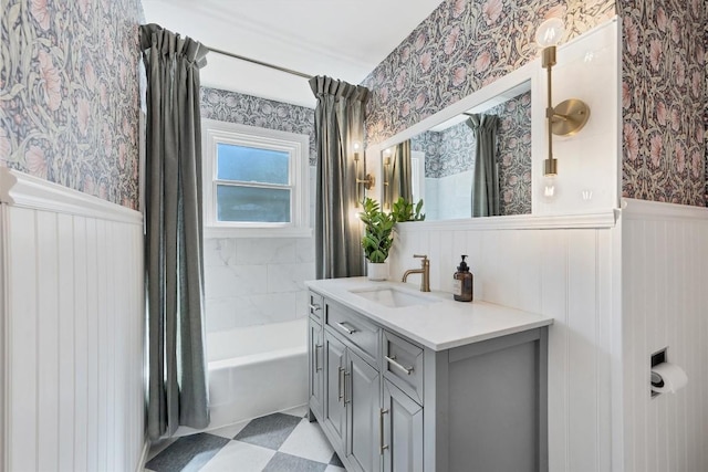 bathroom featuring shower / tub combo and vanity