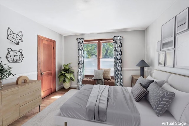 bedroom with light hardwood / wood-style flooring