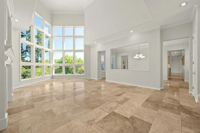 unfurnished living room featuring an inviting chandelier, crown molding, and a high ceiling