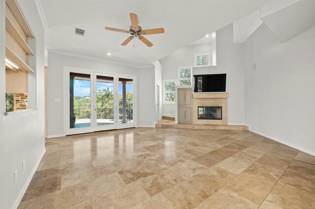 unfurnished living room with a fireplace, ornamental molding, and ceiling fan