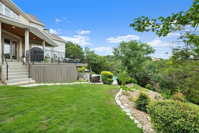 view of yard with a wooden deck