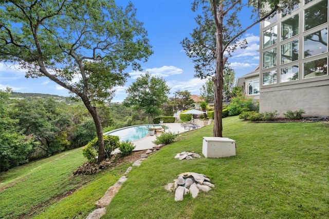 view of yard with a patio area and an outdoor pool