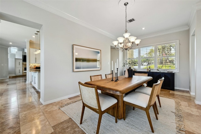 dining space with baseboards, an inviting chandelier, visible vents, and crown molding