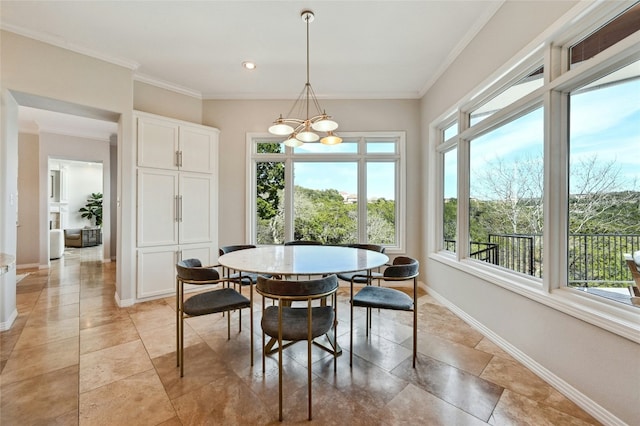 dining space with recessed lighting, baseboards, a notable chandelier, and ornamental molding