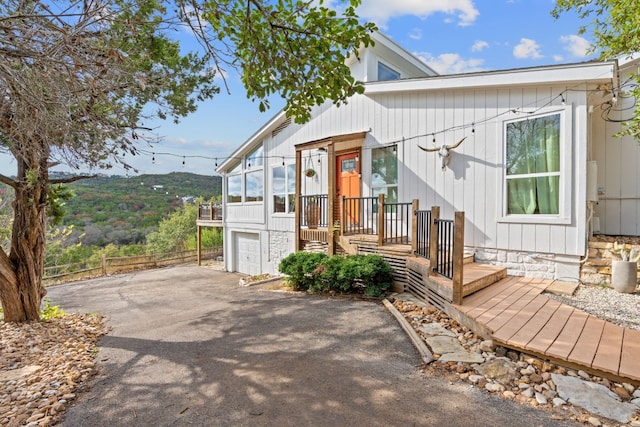 view of front facade with a garage and a mountain view