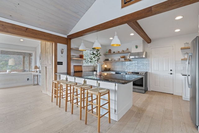 kitchen featuring a breakfast bar, appliances with stainless steel finishes, range hood, decorative light fixtures, and light wood-type flooring