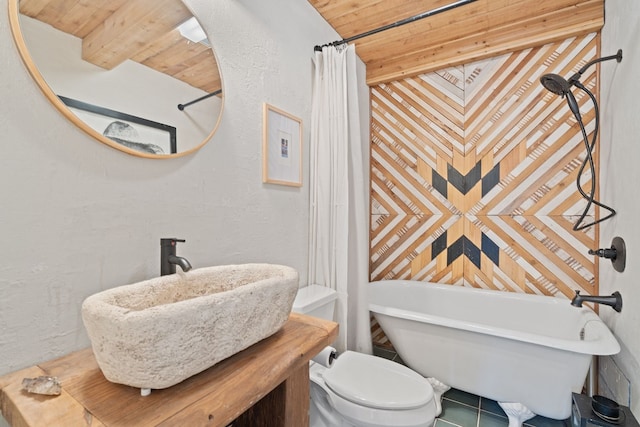 bathroom with sink, wooden ceiling, and toilet