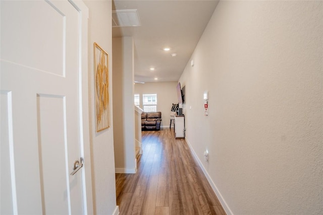 hall with light hardwood / wood-style flooring